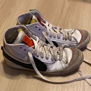 Nike White and Black High-Top Sneakers with Orange Tongue Accents